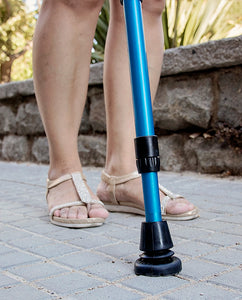woman walking with crutches using esenium tac-55 crutch tips